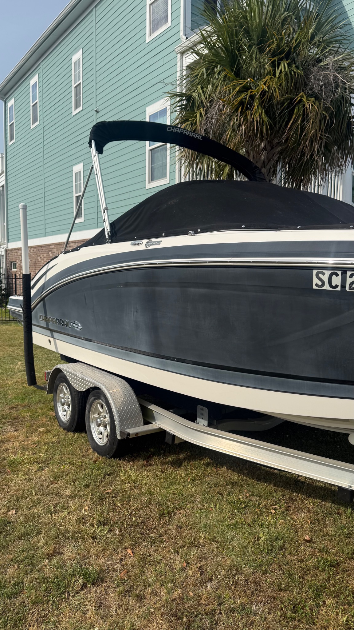 Chaparral boat with a dull, streaked hull before detailing