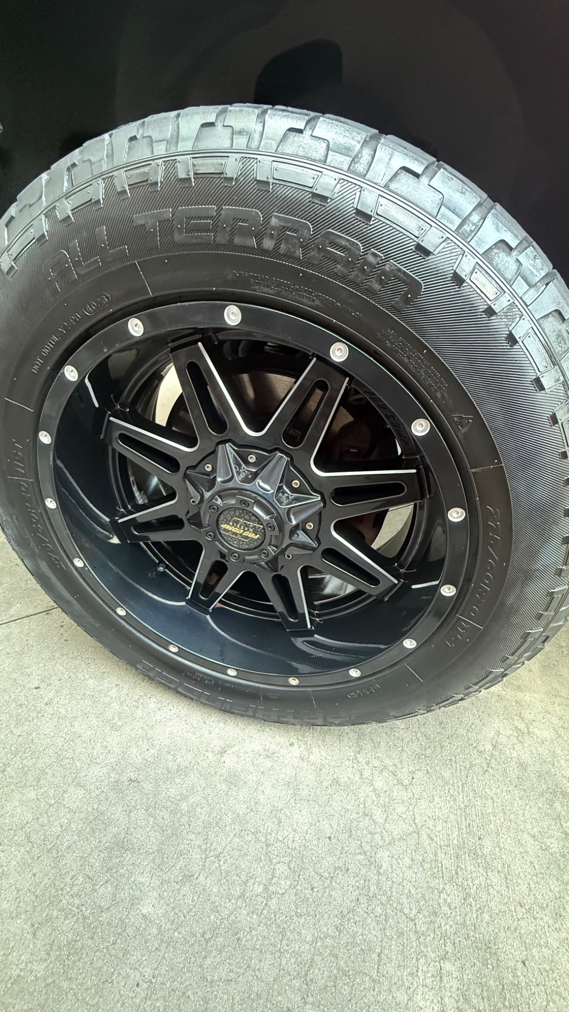 Black wheel and tire after exterior cleaning