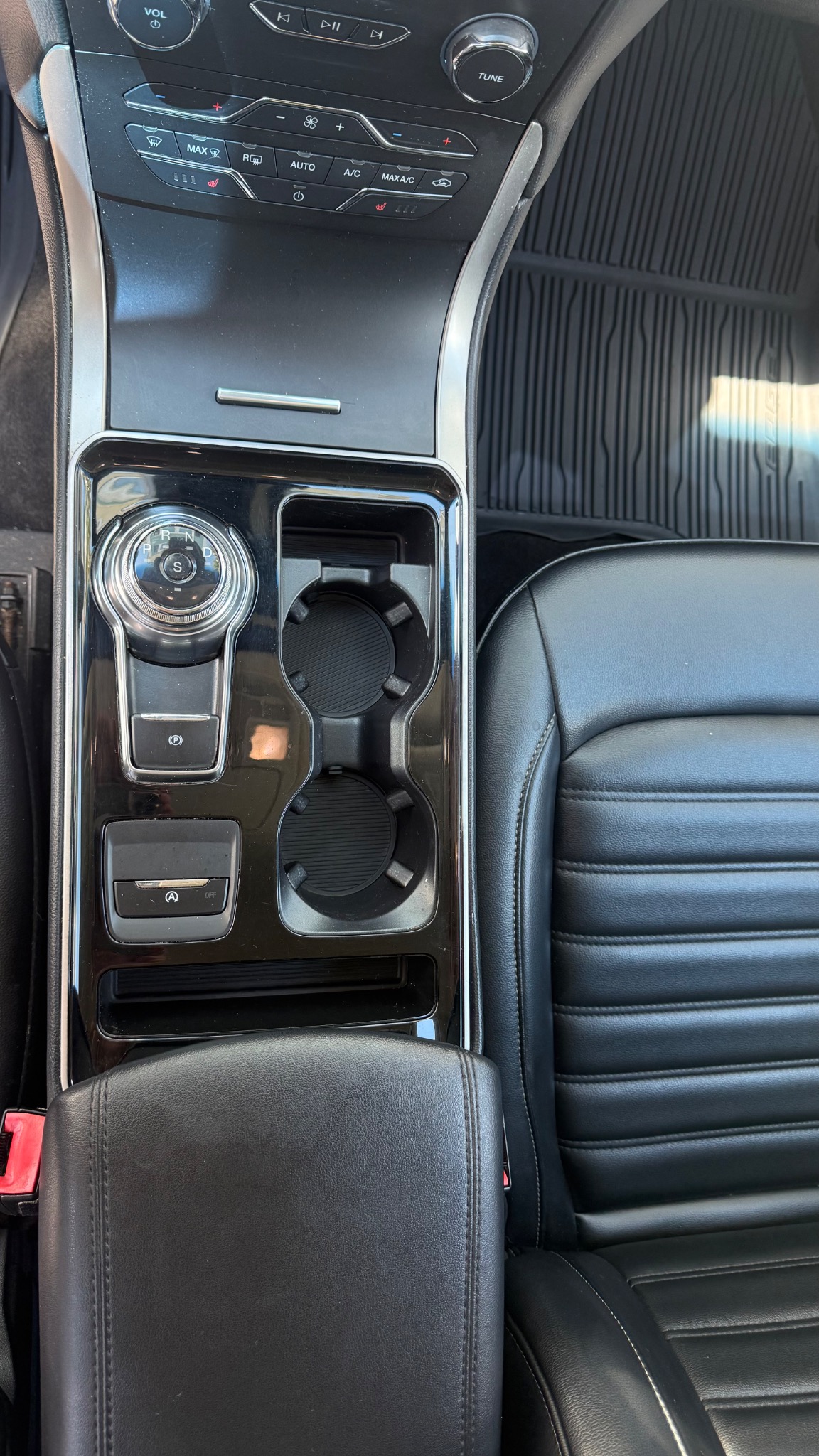 Clean center console and cup holders after interior detailing
